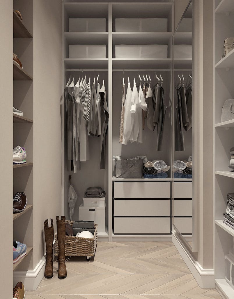 Stylish walk-in closet with neutral tones and contemporary design elements.