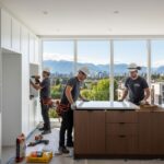 Professional contractors from Markoni Renovations renovating a modern kitchen in a Vancouver home with urban views.