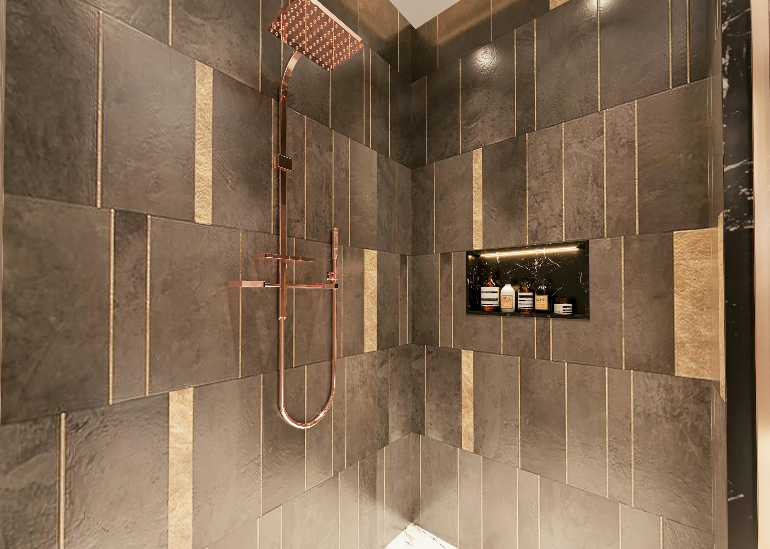 Luxurious modern shower with dark textured tiles and copper fixtures for a sophisticated bathroom design.